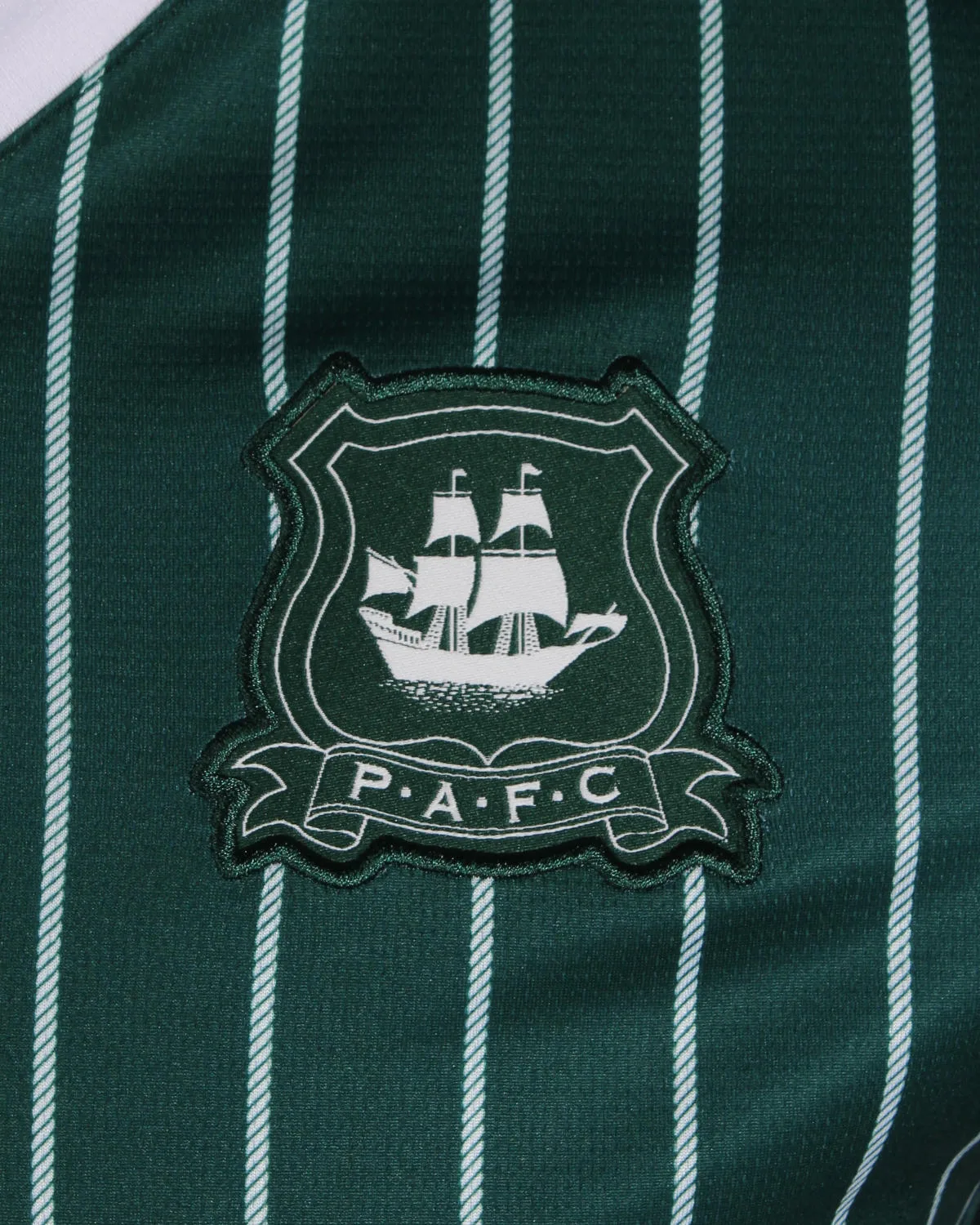 Plymouth Argyle 2026-27 home kit badge detail